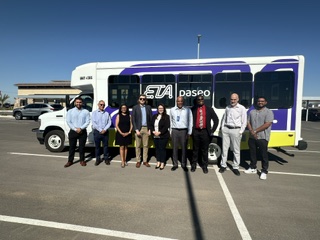 ETA staff and community partners standing in front of an ETA Paseo bus.
